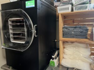 Freeze drying learning center with guides on food preservation and freeze-dried snacks
